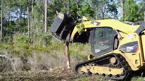 pulling out bushes with a skid steer|Real.